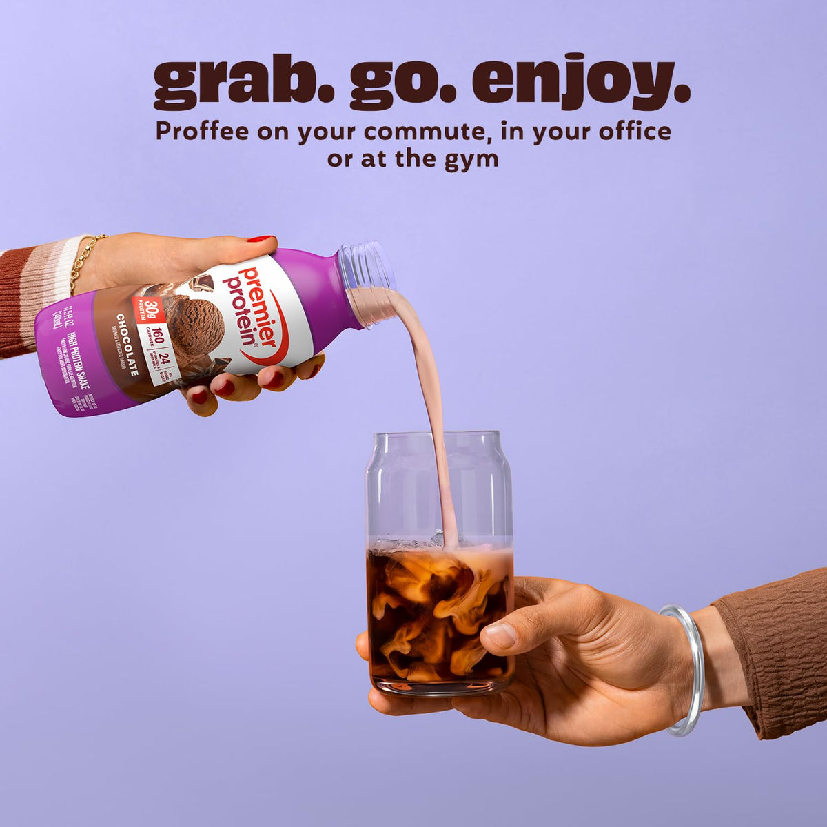 Hand pouring Premier Protein chocolate protein shake into a glass with text 'grab. go. enjoy.'