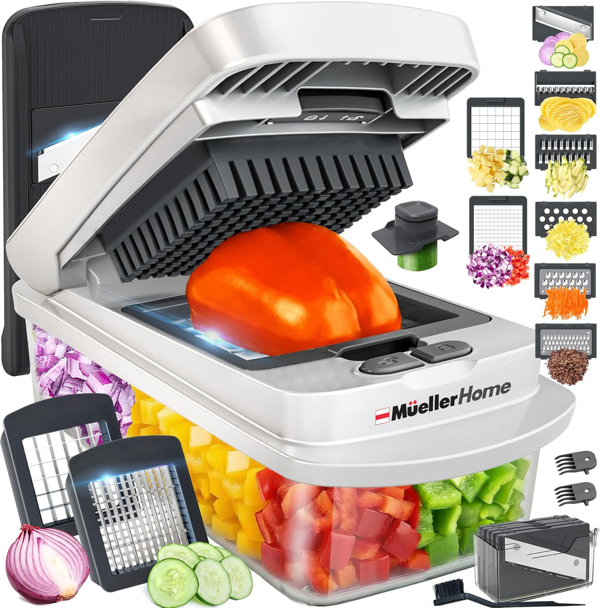 Müller food chopper with a tomato being chopped, surrounded by additional attachments and chopped vegetables.