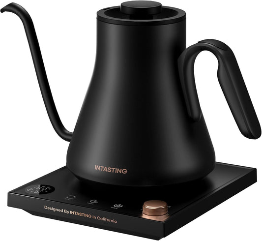 Green electric kettle with wooden handle on a black base, featuring the brand 'INTASTING'.