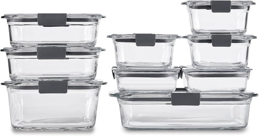 A set of clear glass food storage containers with dark gray silicone seals, shown in multiple sizes stacked together on a white background.