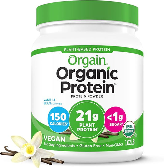 Orgain Organic Protein powder container with vanilla bean and flower on a white background