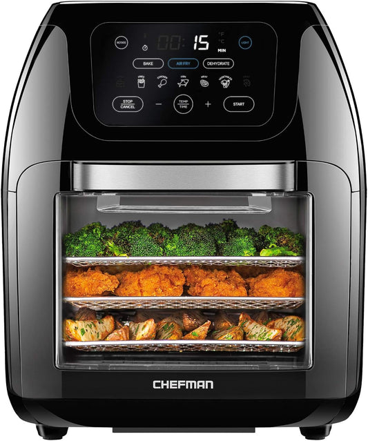 Black Chefman air fryer with a digital control panel and three racks holding broccoli, fried chicken, and roasted vegetables, shown on a white background.